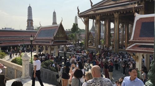 crowd around a temple in bangkok