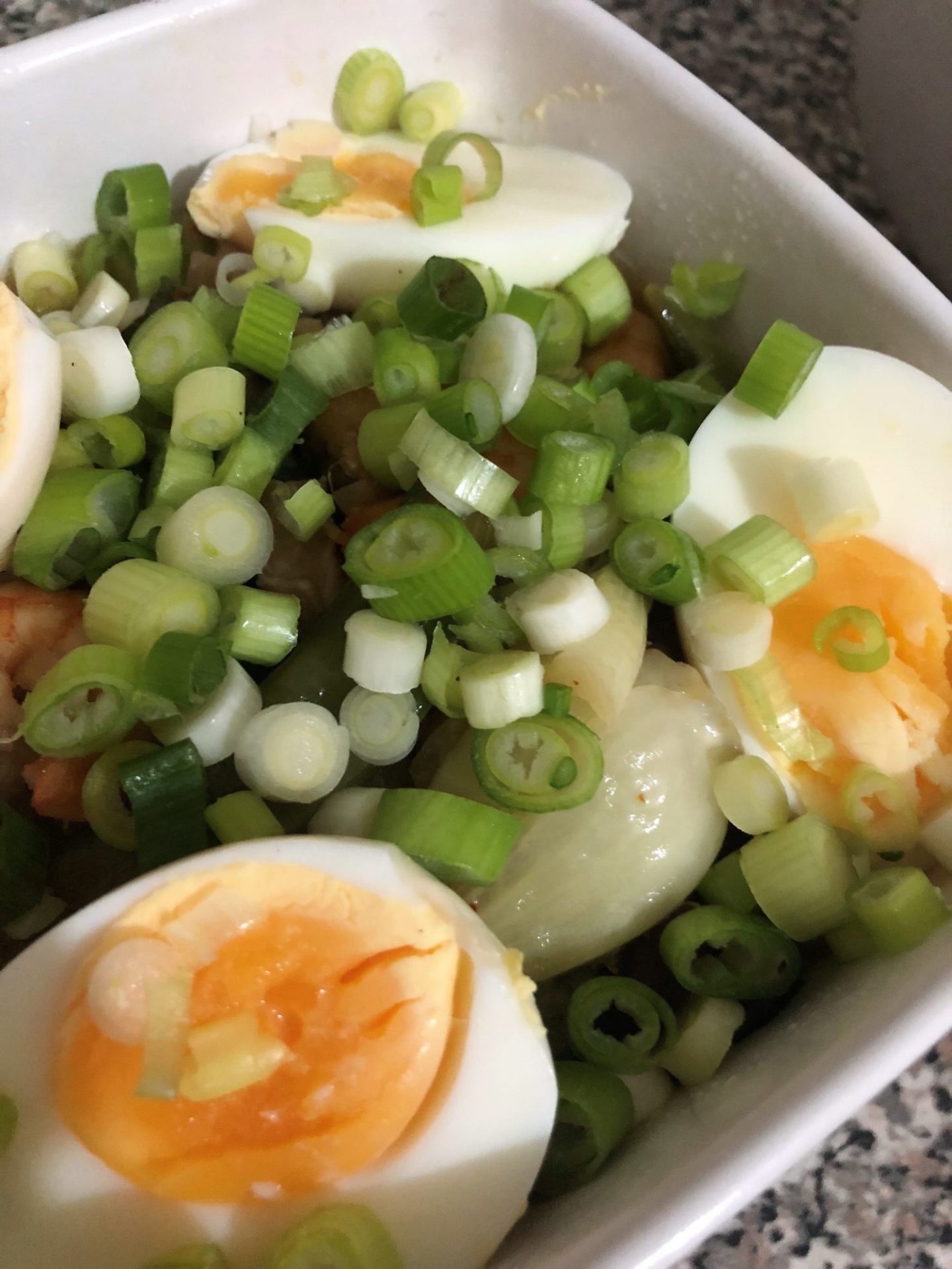 bowl with shrimp ramen and eggs