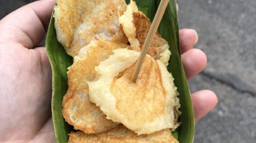 thai coconut pancakes on a small banana leaf plate