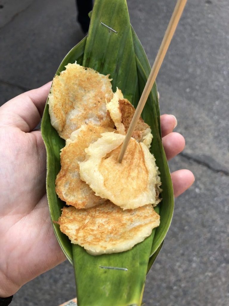 thai coconut pancakes on a small banana leaf plate